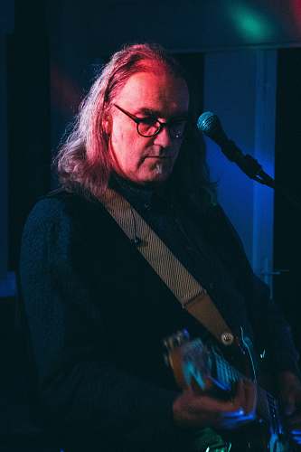 person man playing electric guitar musician