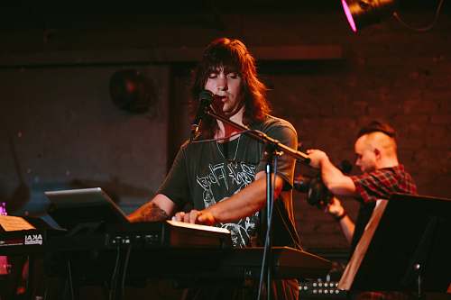 person man playing keyboard musical instrument
