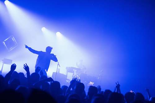 person man standing in front of people crowd