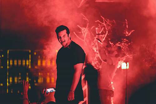 person man standing on stage crowd