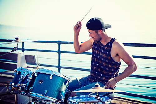 person men playing acoustic drum kit people
