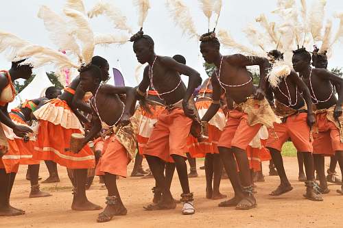 person people dancing on brown soil people