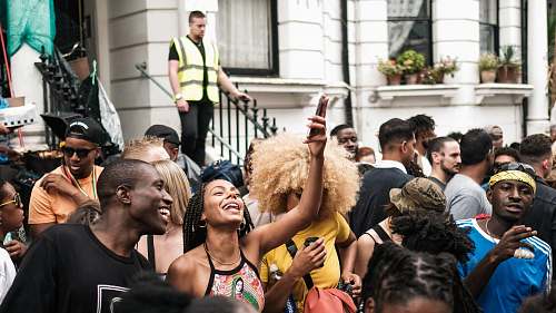person people gathering near buildings accessories