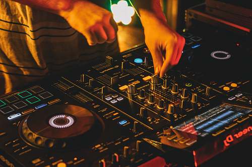 person person playing dj mixer with vinyl record dj