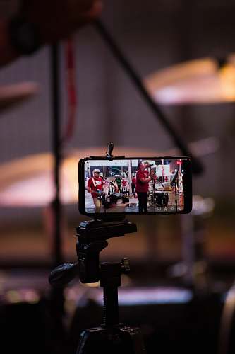 person selective focus photography of black smartphone kuala lumpur
