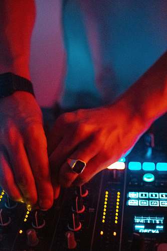 person shallow focus photo of person using turntable dj