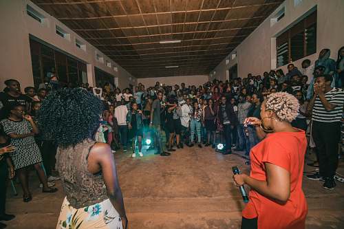person woman holding microphone inside the room kigali