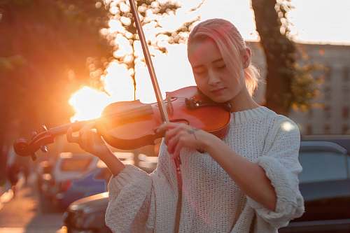person woman playing violin people