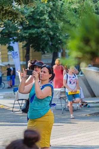 person woman taking picture during daytime burgas