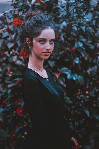 person woman wearing black scoop-neck dress people