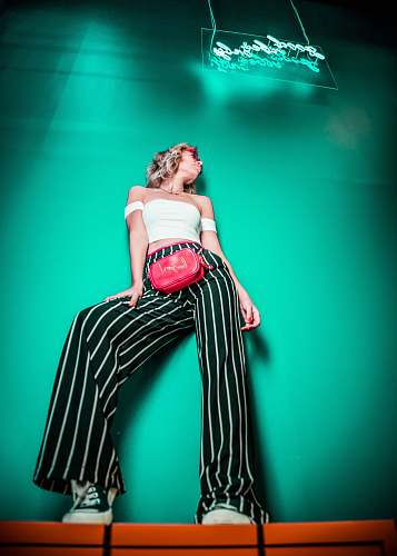person women's black and white striped pants people