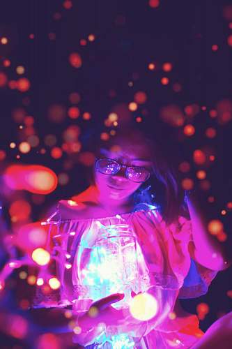 confetti woman holding glass jar with bokeh light background paper