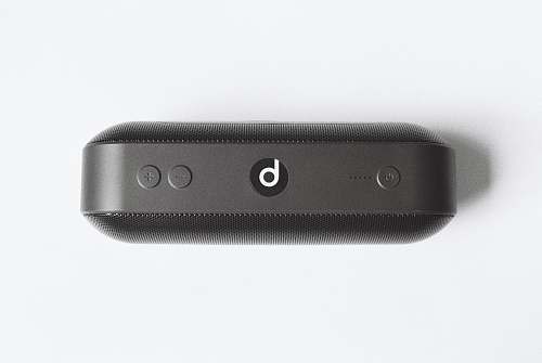grey black Beats by Dr Dre beatspill + on white surface electrical device