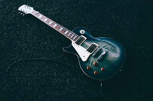 guitar black whiskered single-cutaway electric guitar electric guitar