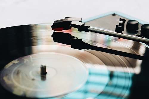 cup close up photography of black turntable coffee table