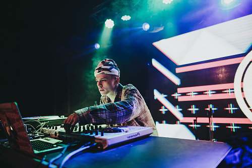 human DJ playing DJ turntable dj