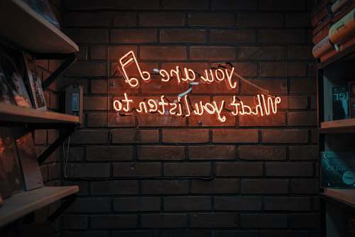 neon lighted red text signage sign