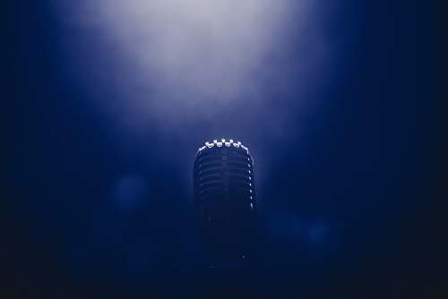 microphone low light stage microphone photography blue