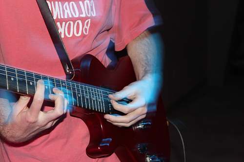 person man playing electric guitar guitar
