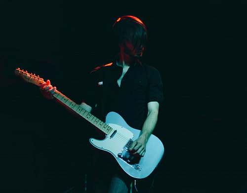 person man playing guitar guitar
