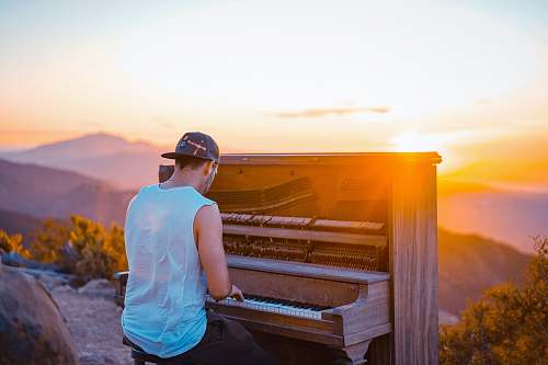piano man playing piano outdoor during sunset human
