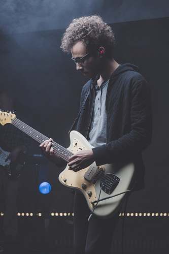 person man playing with electric guitar human
