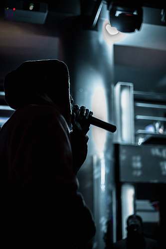 person person in standing position while holding microphone human