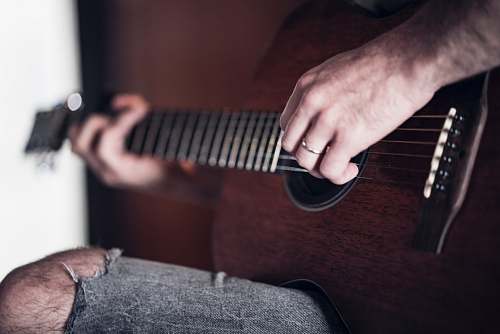 guitar person playing acoustic guitar person