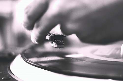 grey person playing vinyl record vinyl