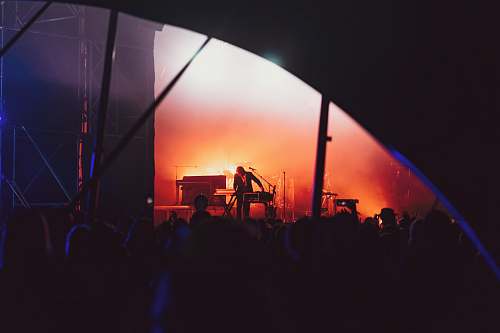 stage person standing on stage in front of crowd leisure activities