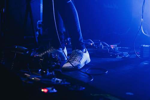 blue person wearing white low-top sneakers foot