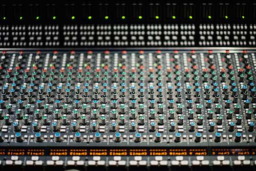 mixer selective focus photography of black and red audio mixer grey