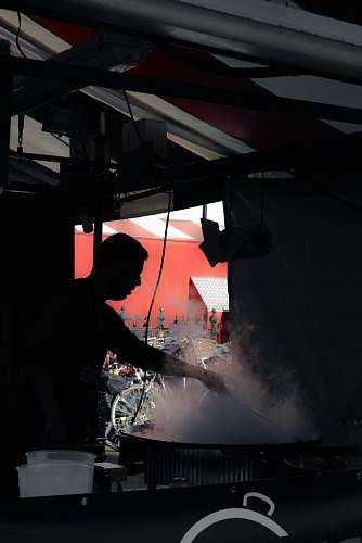 cambridge silhouette of man standing while cooking inside building leisure activities