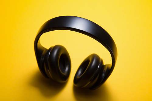 yellow wireless headphones with yellow background headphones