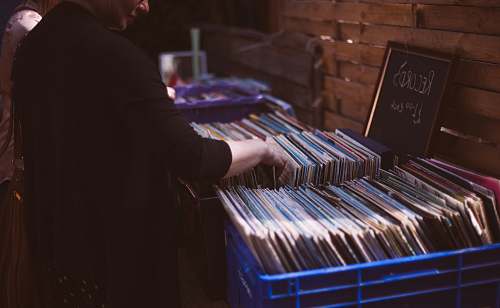 brighton woman holding record album in room united kingdom
