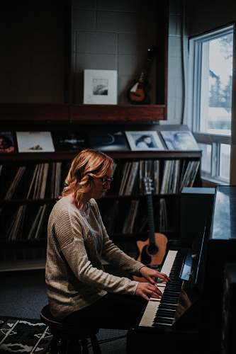 people woman playing piano human