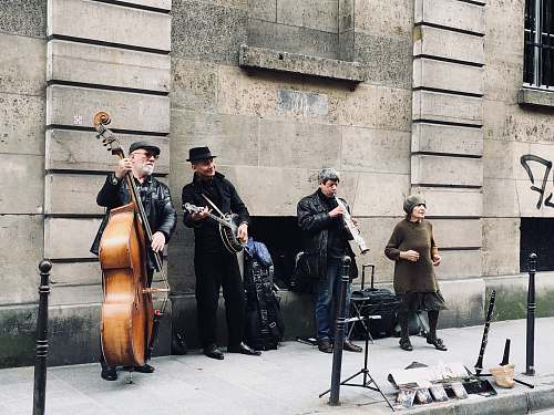 human four men playing instruments musical instrument