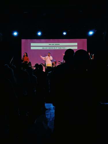 human man singing on stage person