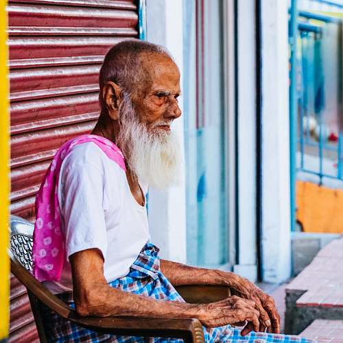 person man sitting on armchair during daytime human