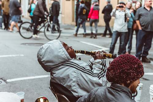 bike man sitting on chair playing flute person