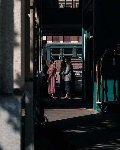 human man standing in front of woman person