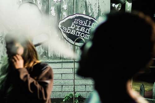person person blow smoke in closeup photography human