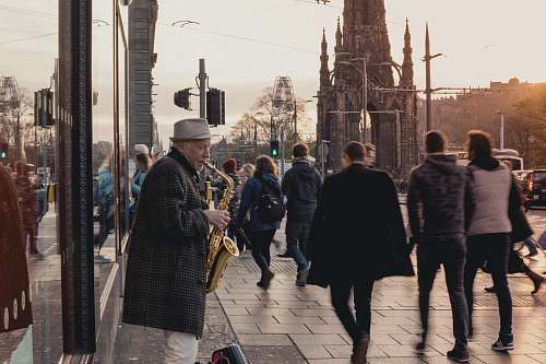 person person playing saxophone in front of people human