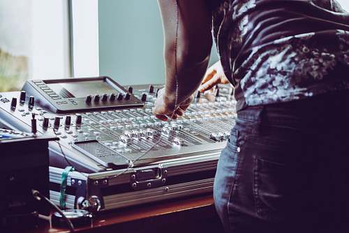 person photo of person adjusting audio mixer human