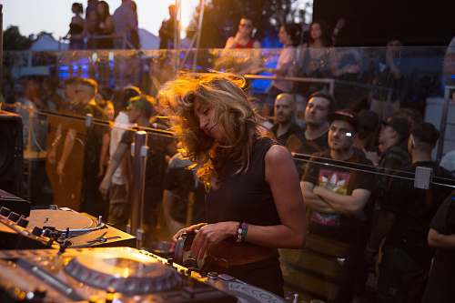 human woman playing dj turntable person