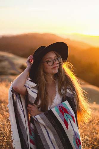 person woman surrounded by plants during sunset human