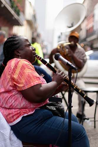 human woman using black clarinet person