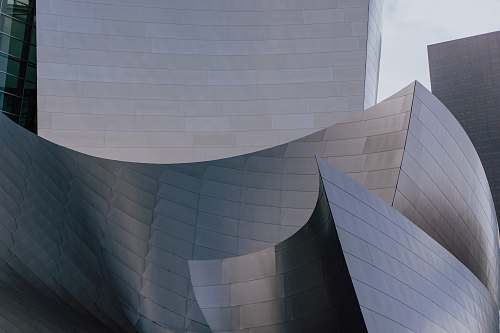 grey gray tiled building walt disney concert hall