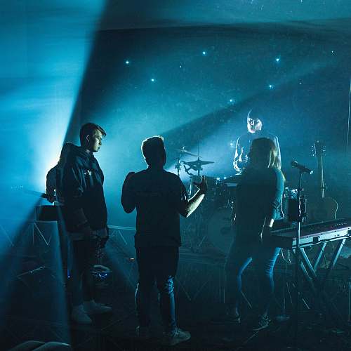 human group of band members having discussion on stage people