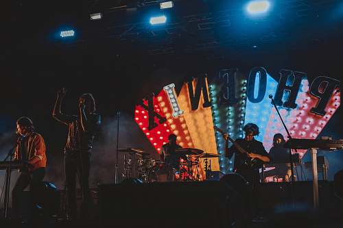 human group of band performing on stage people